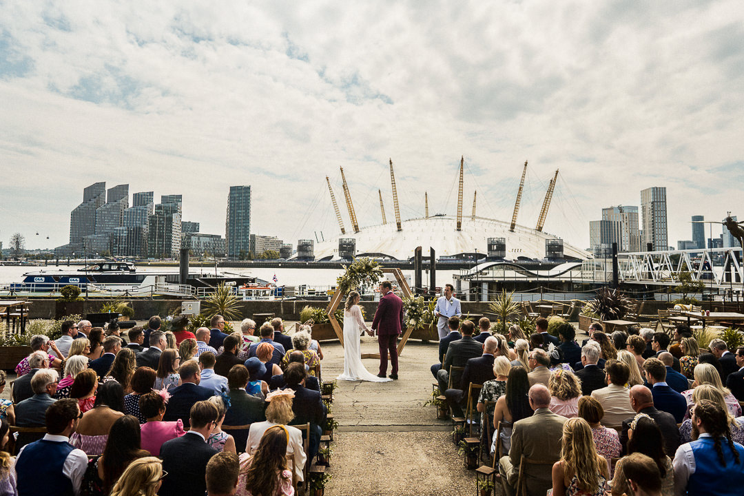 outdoor ceremony set up overlooking the thames at trinity buoy wharf